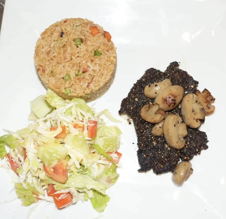 Grilled Peppered Chicken Spicy grilled boneless chicken served with fried rice or chips and coleslaw